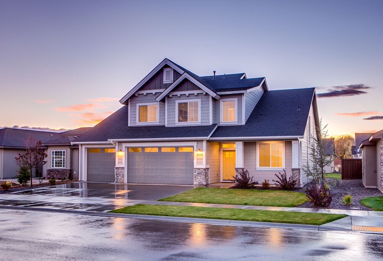 Crafting Captivating Headlines: Your awesome post title goes here Elegant suburban home with driveway at sunset showcasing modern architecture.